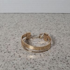 Gold-Tone Bangle Bracelet‎ with Safety Chain